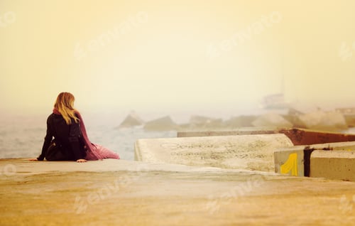 Preview: A Woman Looking At The Sea And Wondering About The Past. Image Has A Vintage Effect.