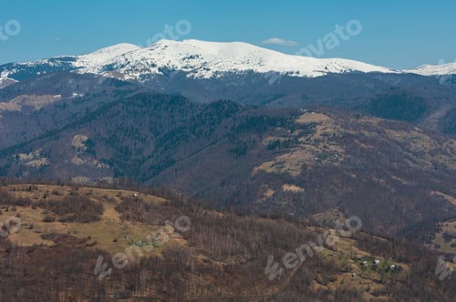 Preview: Early Spring Carpathian Mountains Plateau Landscape With Snow-Covered Ridge Tops In Far, Ukraine.