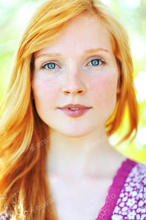 Preview: Headshot of a Woman with Flowing Red Hair