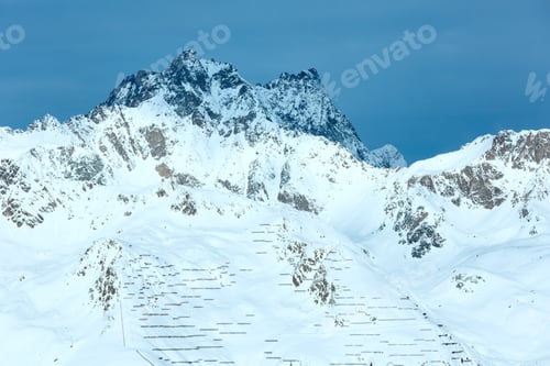 Preview: Morning Winter Silvretta Alps (Austria) Landscape And Fencing Against Sliding Down Snow On Slope.