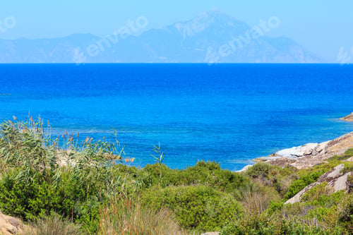 Preview: Summer Stony Sea Coast Landscape With Atthos Mount View In Far(Halkidiki, Sithonia, Greece).