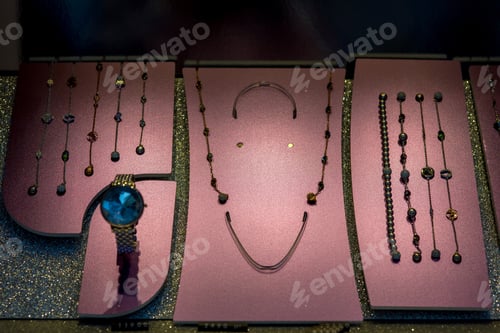 Preview: Showcase With Chain Jewelry With Bracelets And Decorative Stones On A Demonstration Surface