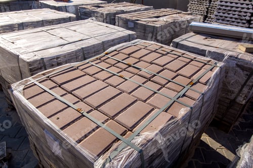 Preview: New Paving Stone Tiles Folded And Packed On A Pallet Pulled Together By Slings, Close Up.