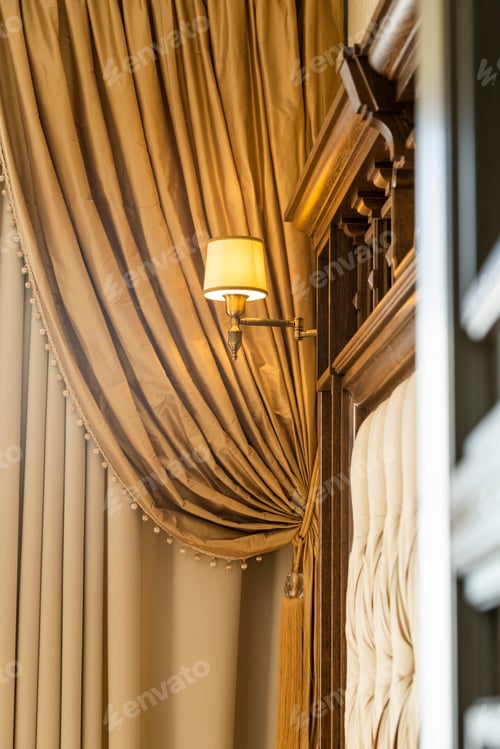 Preview: Included Wall Sconce Above The Headboard Of A Wooden Bed In The Interior