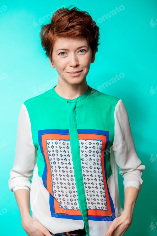Preview: Cheerful Beautiful Young Street Girl With Pale Skin Posing To The Camera On The Blue Background