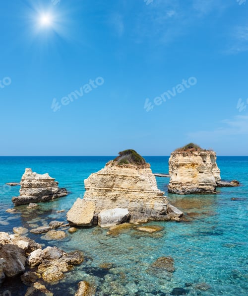 Preview: Picturesque Sunshiny Seascape With White Rocky Cliffs, Sea Bay, Islets And Faraglioni At Beach