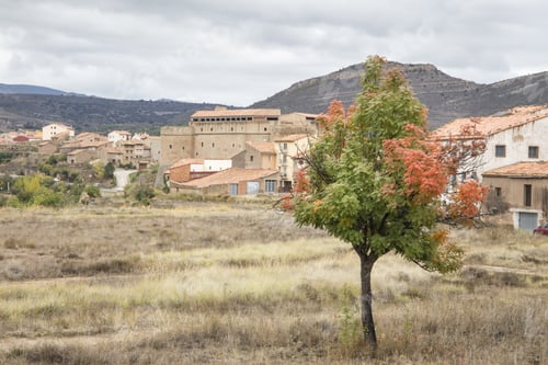 Preview: Autumn Landscape With Yellow Leaves Gudar Mountains Teruel Aragon Spain. Mora De Rubielos Village.