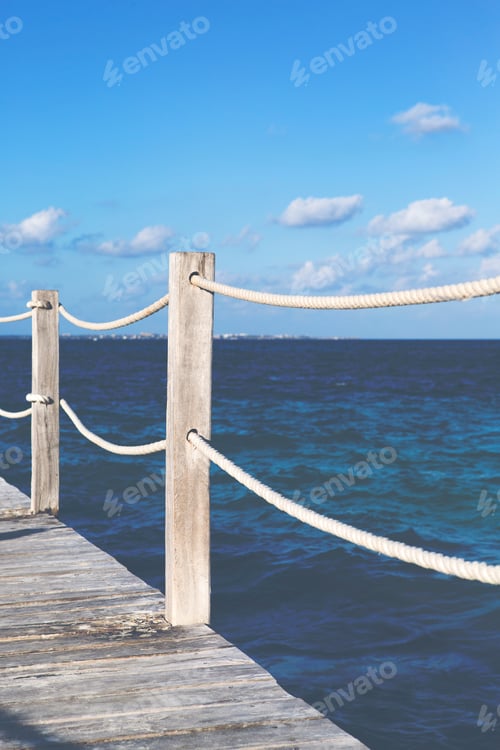 Preview: Wooden Pier With Ropes And The Caribbean Sea. Image Has A Vintage Effect Applied.