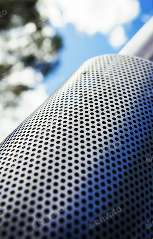 Preview: Metal Surfaced Chimney Pointing To The Sky With Clouds. Image Taken From Low Point Of View And In