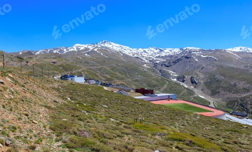 Preview: Summer Mountain Landscape With Snow On Peak And Stadium (Sierra Nevada National Park, Near Granada
