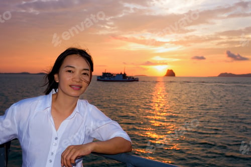 Preview: Beautiful Nature Of Colorful Sky And Sun At Sunset Over The Sea, Women Tourist On The Deck Of A