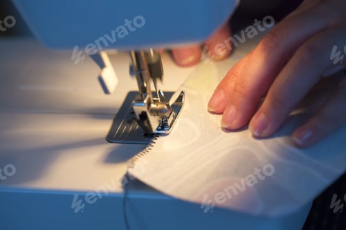 Preview: Woman Is Sewing In A Low Light.