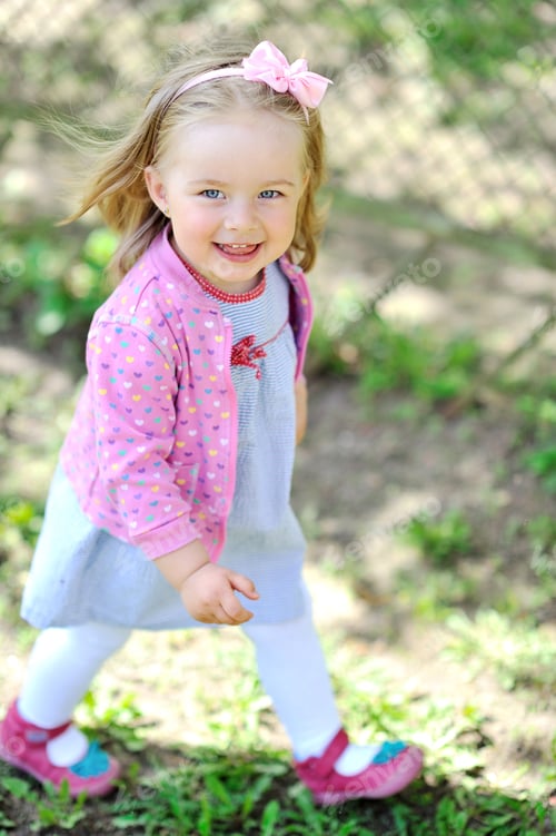 Preview: Cute Little Girl Walking And Smiling To You - Casual Outdoor Portrait