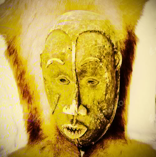 Preview: Handmade Antique Mask On The Background Of Fur Of Wild African Animal. Retro Style