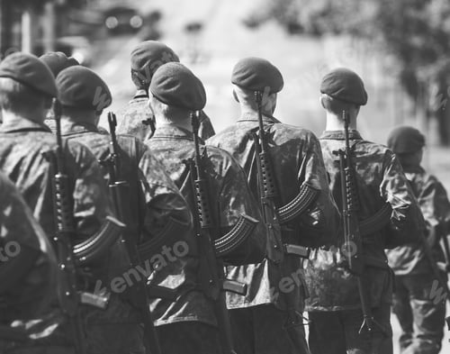 Preview: Soldiers Marching In The Streets With Guns On Their Shoulders. Image Has A Vintage Effect Applied.