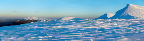Preview: Mountain Ridge Sunset Panorama In Blue-Pastel Tones With Evening Shadows From Snowdrifts (Ukraine