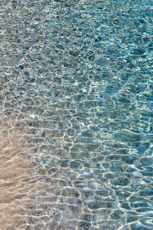 Preview: Blue Sea Flowing Water Surface With Waves And Some Pebbly Bottom View. Abstract Background Pattern.