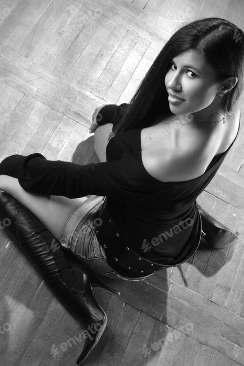 Preview: Portrait Of Beautiful Brunette Sitting On The Floor