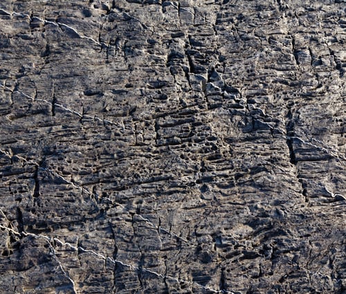 Preview: Part Of Rock Closeup With White Stripes Of Another Geological Material. Nature Background.