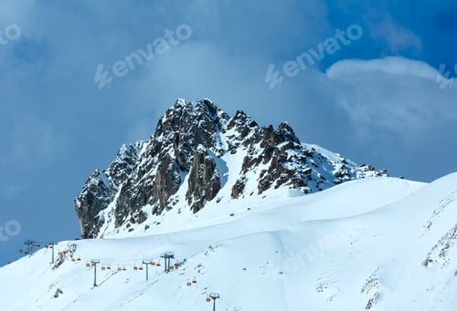 Preview: Winter Rocky Mount Top (Tyrol, Austria) And Ski Lift On Slope.