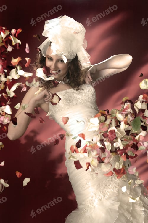 Preview: Portrait Of Bride With Rose Petals On The Background Of Fire