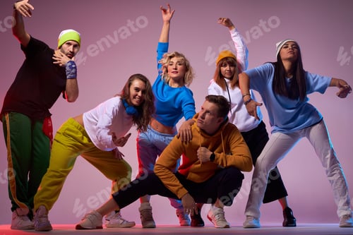 Preview: Group Of Cheerful Playful Dancers Standing On Stage, Raising Happily Hands, Surrounding Serious