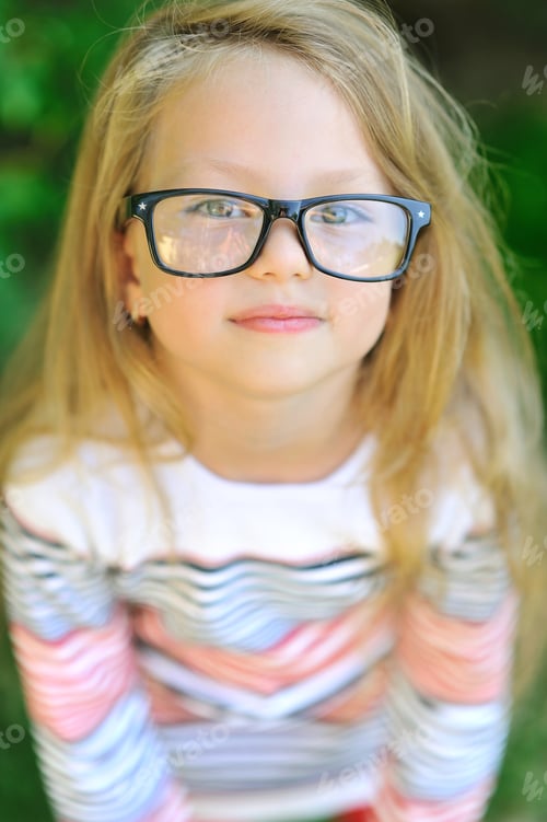 Preview: Little Girl In Glasses - Closeup Portrait