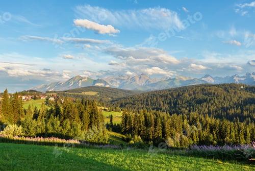 Preview: Summer Evening Mountain Village Outskirts With Houses On Hill Top And Tatra Range Behind (Poland)
