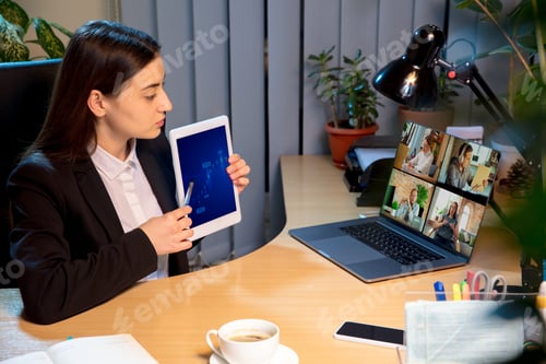 Preview: Presentation. Young Woman Working In Videoconference With Colleagues, Co-Workers At Home. Online