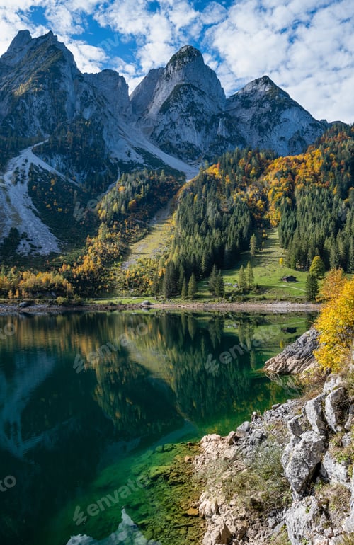 Preview: Sunny Idyllic Colorful Autumn Alpine View. Peaceful Mountain Lake With Clear Transparent Water And