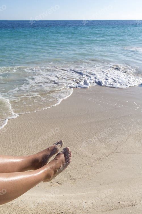 Preview: Sexy Legs On The Beach. Woman'S Feet In The Air And The Caribbean Sea In The Background. White Sand