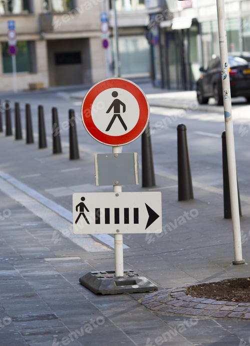 Preview: A Traffic Sign Telling Pedestrian To Change Sides And Going In That Direction.