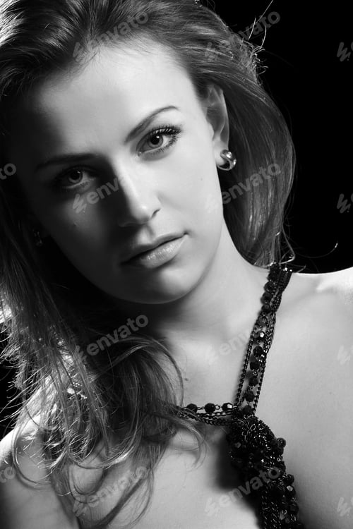 Preview: Portrait Of A Beautiful Brunette On Black Background