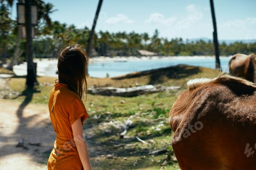 Preview: Woman With A Horse On The Grass Near The Sea In Nature