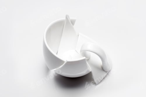 Preview: Broken White Ceramic Tea Cup On A White Background, Conceptual Photo With A Shattered Object.