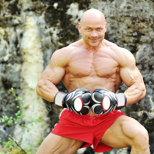 Preview: Muscular Young Man Wearing Boxing Gloves