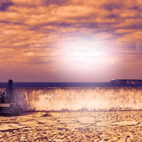 Preview: Old Rusty Cannon Guarding The Portuguese Fortress Sagres On The Atlantic Ocean Beach In The Light