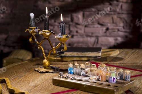 Preview: Burning Candles In A Candlestick On A Table