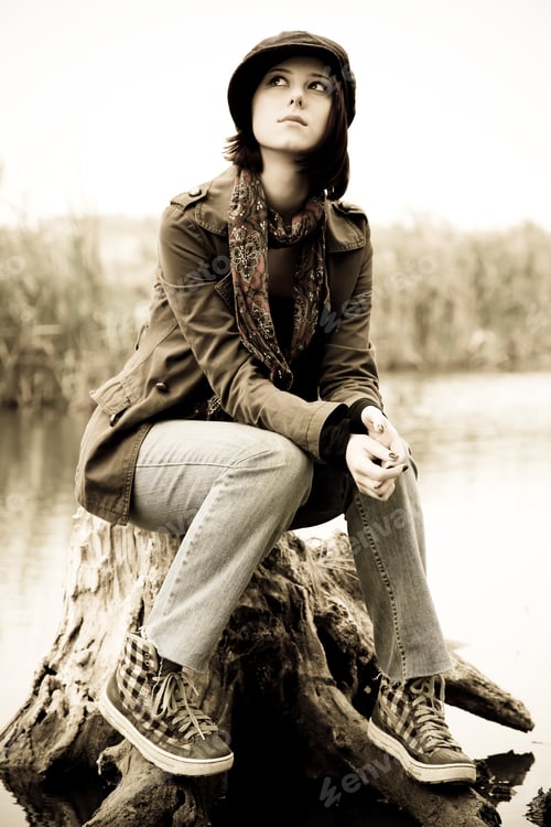 Preview: Girl Sitting At Stub In Water. Photo In Vintage Style.