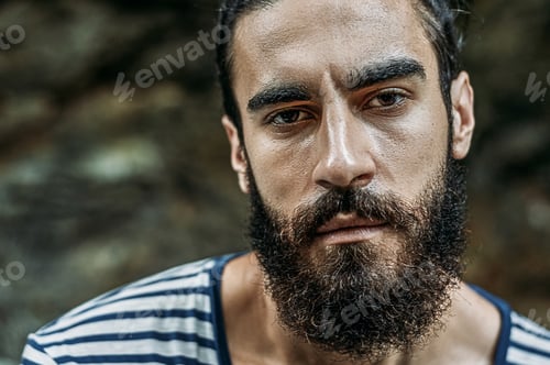 Preview: Portrait Of A Brutal Bearded Man Looking At Camera