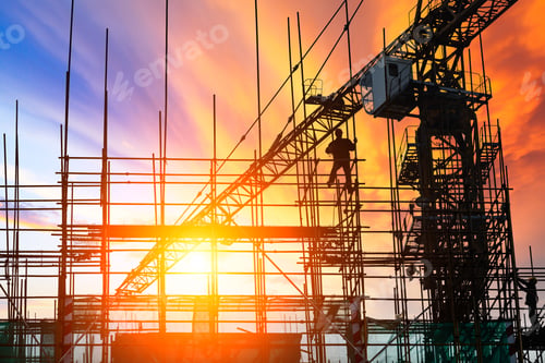 Preview: Construction Site With Crane And Workers At Sunset