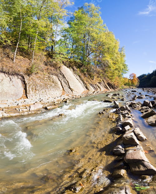 Preview: Autumn Mountain Stony River View With Varicolored Trees On Riverside. Two Shots Stitch Image.