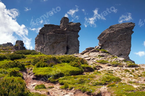 Preview: Big Stony Figure On Mountain Ridge