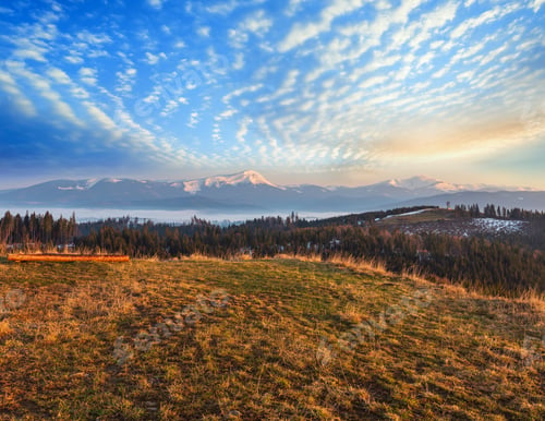 Preview: Early Morning Spring Carpathian Mountains Plateau Landscape With Snow-Covered Ridge Tops In Far