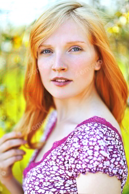Preview: Attractive Woman Poses in Front of Floral Background
