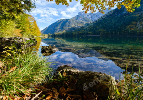 Preview: Sunny Idyllic Colorful Autumn Alpine View. Peaceful Mountain Lake With Clear Transparent Water And