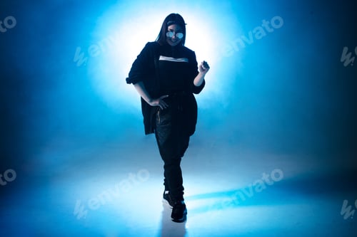 Preview: Trendy Young Woman Dancing Single In Club, Neon Light, Lots Of Smoke. Fashion Street Wear