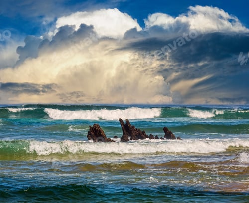Preview: Sea Surf Waves And Small Rocks In Center. Seascape View From Beach.