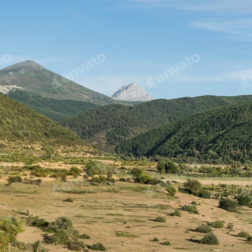 Preview: Beautiful Landscape In Spain With Dramatic View Of Cantabrian Mountains. Dry Riverbed On The Bottom
