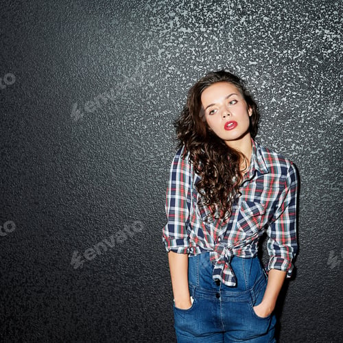 Preview: Stylish Beautiful Young Woman Model Posing Over Black Wall